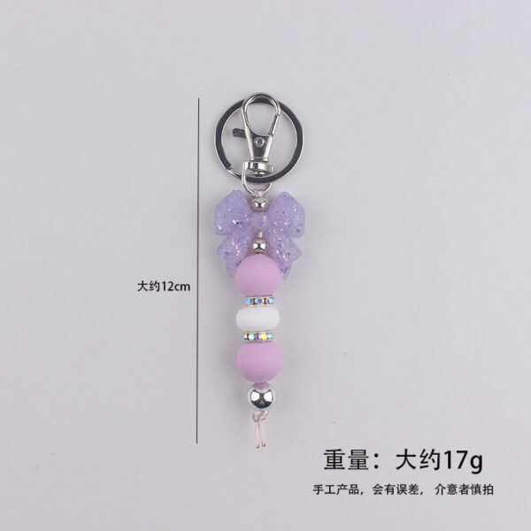 oly-7b788128f6c4141c2b1374b44f7718ba Wholesale Silicone Bow Beaded Bag Charm Keychain Fashion Accessory Gift for Party