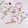 oly-7c2dd58a30c1e3e84bdb38876b7e0eea Wholesale Silicone Moon Bead Tassel Keychain Korean Style Fashion Accessory Gift