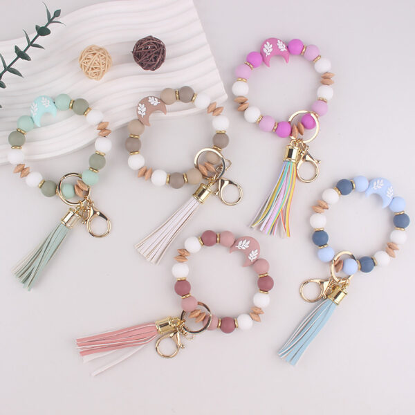 oly-7c2dd58a30c1e3e84bdb38876b7e0eea Wholesale Silicone Moon Bead Tassel Keychain Korean Style Fashion Accessory Gift