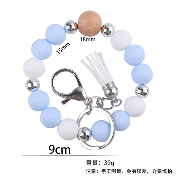 oly-7d261efdecbc347bd46e9a109bce37d8 Wholesale Light Yellow Silicone Korean Style Wrist Keychain with Tassel Fashion Accessory Gift Boutique Resale