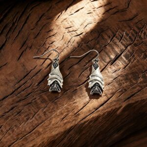 A pair of silver devil bat pendant ear hooks