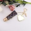 oly-7f40688be0035565b23c31cf1ce16e75 Wholesale Metal Mesh Pouch Bag Charm Keychain Trendy Personalized Design for Everyday Use