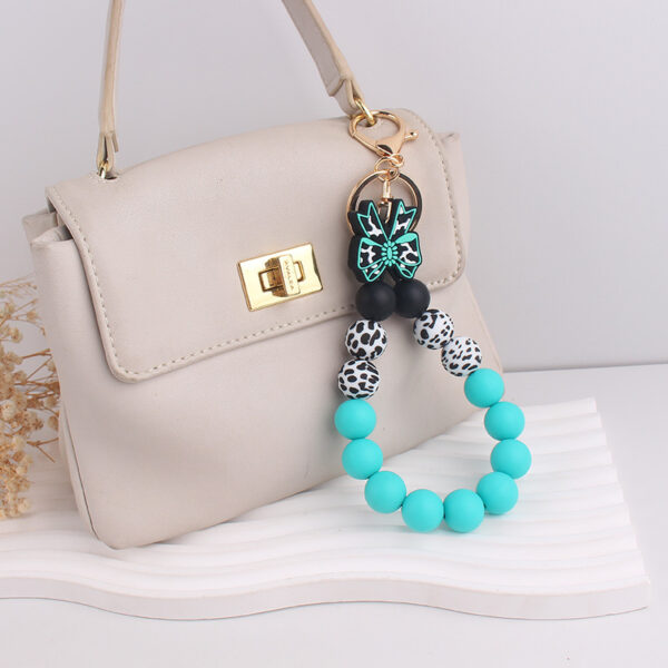oly-819ebcb5fd3248261185007115bbab2b Wholesale Korean Style Silicone Cow Bow Keychain Charm Trendy Bag Car Key Accessory Gift