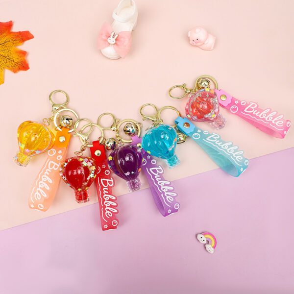 oly-828d42a874b26d5dc133d8da9654477f Wholesale Decorative Pink Hot Air Balloon Acrylic Keychain with Oil Filled Quicksand Bag Charm Gift