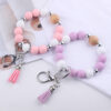oly-83110547db5b7b8e42500f1f5e737939 Wholesale Light Yellow Silicone Korean Style Wrist Keychain with Tassel Fashion Accessory Gift Boutique Resale