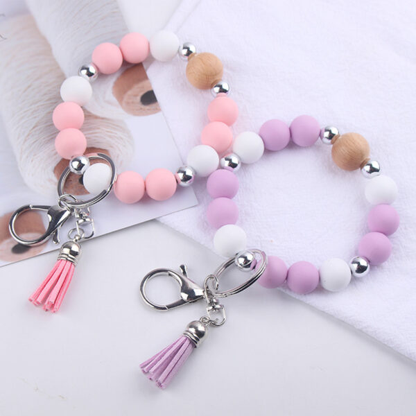 oly-83110547db5b7b8e42500f1f5e737939 Wholesale Light Yellow Silicone Korean Style Wrist Keychain with Tassel Fashion Accessory Gift Boutique Resale