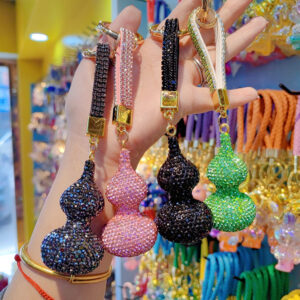 oly-84ce9fed0888e3b824a0b9cfe3c97d6d Wholesale Diamond Gourd Metal Keychain Red Car Key Accessory Bag Charm for Resale