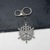 oly-86722faac615398f09a3ff1fbda29c5e Wholesale Retro Silver Snowflake Pendant Keychain Zinc Alloy Car Key Accessory
