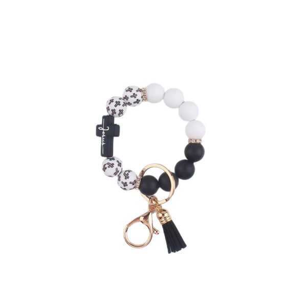 oly-86e8d64309c128e352d9632afaf7641e Wholesale Silicone Cross Print Bead Bracelet Keychain with PU Tassel Fashion Accessory for Resale