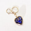 oly-8b0bda329f59c577e141657a43f2ba19 Wholesale Fashion Metal Heart Keychain Pendant, Red Hollow Design, European Style Bag and Key Accessory OLY Exclusive