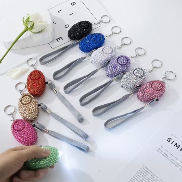 oly-8caa6a848afe25b3d15dedcb81e37c19 Wholesale Diamond Studded Personal Safety Alarm Keychain White Metal Fashion Accessory for Women Boutique Resale Gift