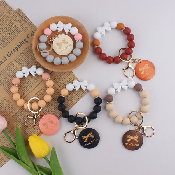 oly-8f90e6877b2c538faa83d6a48cbf61e9 Wholesale Trendy Silicone Bow Keychain Bracelet Mother's Day Gift Car Key Accessory