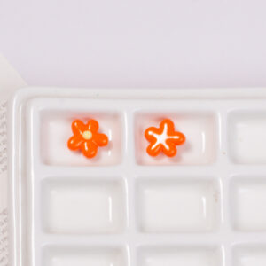 Orange dotted oil flower