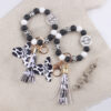 oly-92bdda084a496ccf357a5ab6772ae0a3 Wholesale Silicone Cartoon Cow Head Keychain with Bead Bracelet and Tassel Korean Style Decorative Accessory