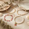 oly-938a5e2ad5956b9ccf8332d34371cd57 Wholesale Sweet Cherry Pearl Multi Layer Bracelet Set Alloy Electroplated Jewelry Gift for Women