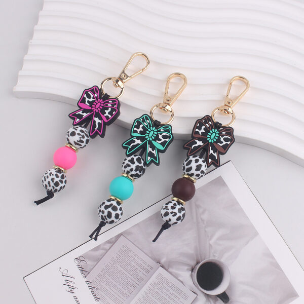 oly-944b0d007dd0d2d9d2e28a2a55d6cfbf Wholesale Silicone Keychain with Denim Style Bow Fashion Accessory for Bags Keys Gifts