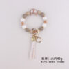 oly-9504344929c8d9d94bec3ebfee59fbcc Wholesale Silicone Moon Bead Tassel Keychain Korean Style Fashion Accessory Gift