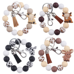 oly-97e0143fcc1a7d714ddf22d2421d37a8 Wholesale Silicone Cartoon Cow Keychain with PU Leather Tassel Fashion Accessory Bag Charm for Gift Boutique Resale