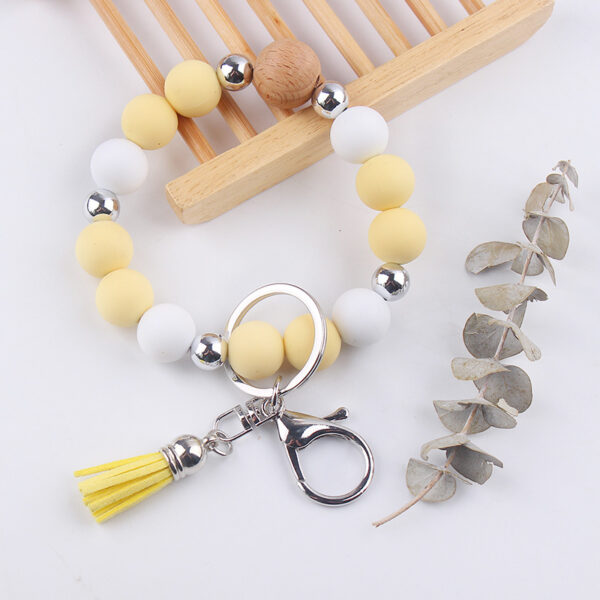 oly-98a6e4d529c9a2ba67439fadb75d65aa Wholesale Light Yellow Silicone Korean Style Wrist Keychain with Tassel Fashion Accessory Gift Boutique Resale