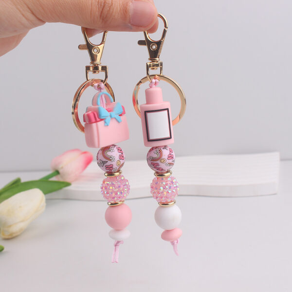 oly-9b6c6deebb4a2cf37ec3e81414954d77 Wholesale Fashion Silicone Perfume Bottle Keychain Resale Gift Accessory