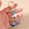 oly-9bb7ff0ae14587fc811b6f45edf303d2 Wholesale Trendy Shell Whale Keychain Zinc Alloy Cartoon Ocean Animal Bag Charm