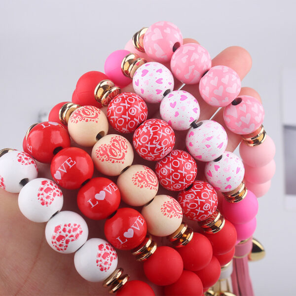 oly-9cc47e017bf9375763dc63f1dab6739d Wholesale Silicone Heart Bead Bracelet Keychain with Leather Tassel European Style Gift