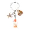 oly-a01fe973d4fa60ff79c585574be4d855 Wholesale Luminous Seashell Keychain Seaside Vacation Decorative Accessory Gift