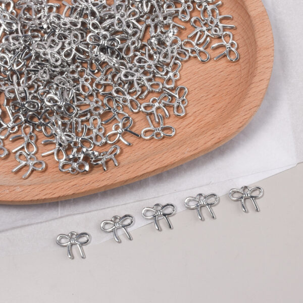 oly-a1b5af37a04b934b077cd13e8f4904c2 Wholesale Trendy Small Bow Tie Pendant Zinc Alloy Fashion Accessory for DIY Jewelry Making Gift Resale