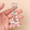 Wholesale Resin Golden Love Bow Heart Key Chain, Pearl Bow Keyring Trendy Boutique Resale Key Accessory