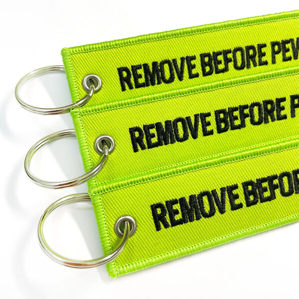 Wholesale Grass Green Flight Tag Keychain with Remove Before Pew Pew Text - Car Key Accessory Gift