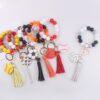 oly-a4766805dda227b5a19bd253fdcecef2 Wholesale Silicone Football Wrist Keychain with DIY Beads Trendy Fashion Accessory for Gift or Everyday Use