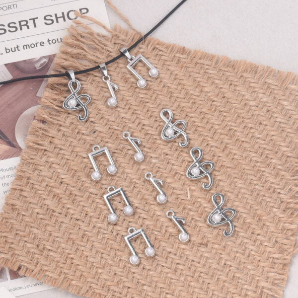oly-a5f8930cb1fd6f97bebcc6d51125dbc8 Wholesale Zinc Alloy Electroplated White Music Note Pendant DIY Keychain Accessory Fashion Craft Supply