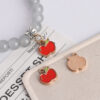 oly-a91635e9fe4907eb9507e30456d82ffc Wholesale Alloy Red Pendant Charm Stylish DIY Phone Chain Bracelet Accessory for Everyday Wear