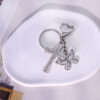 Wholesale Silver Alloy Butterfly Cross Keychain Decorative Car Key Accessory Stylish Boutique