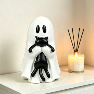 Large ghost-shaped black cat held upright
