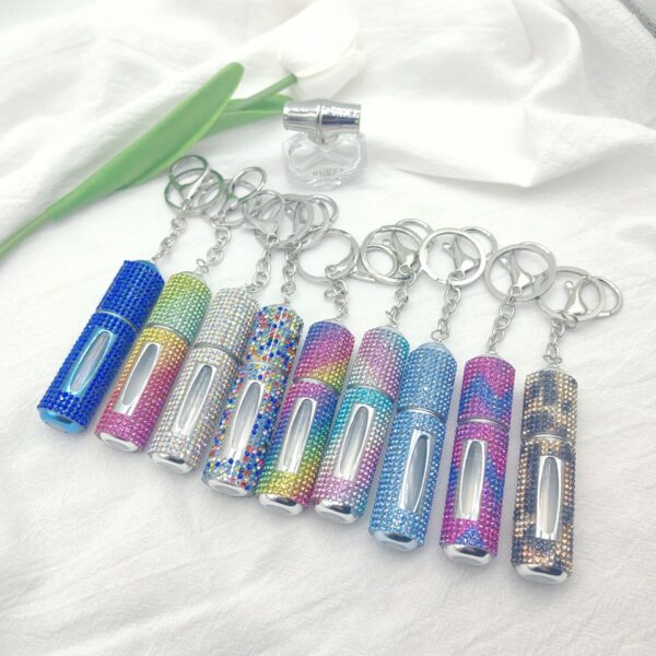 oly-aa63c6aece6ed31b2c26e41152feab62 Wholesale Fashion 5ml Refillable Perfume Spray Bottle Keychain Rhinestone Metal White Gift