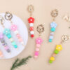 oly-aac043f2c3adc51c8431d6b43fefdc81 Wholesale Pink Silicone Bead Bracelet Cartoon Flower Keychain DIY Pendant Fashion Accessory Gift