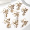 oly-ac793c3a5b5561d5cf393122e2d64f9b Wholesale Resin Gold Plated Shell Keychain Pendant for Bag Car Decoration Boutique Resale