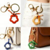 oly-ace2871e54e3f717f9815988d0a779c5 Wholesale Trendy Hand Knitted Natural Stone Flower Keychain Bag Charm