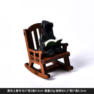 Dy2265b black man reading + rocking chair halloween ornament
