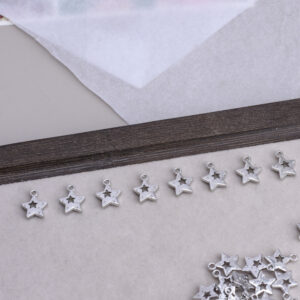 oly-ae47f4b726c94ce899193b60f7c84f54 Wholesale Hollow Five Pointed Star White Tone Alloy Charm DIY Jewelry Bag Charm Fashion Accessory