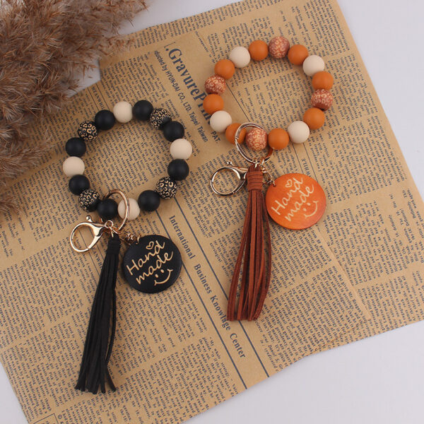 oly-ae775434f3939a3aefecdcd88ab26bd5 Wholesale Face Silicone Keychain Key Ring Party Gift Bag Charm Accessory
