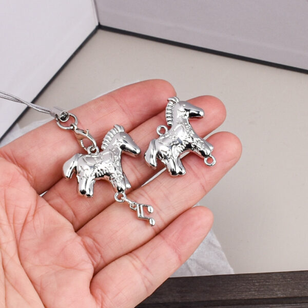 oly-aff9156fe0dd84f78541fce43ceb3333 Wholesale Alloy Double Sided Pony Pendant Charm Trendy Car Key Accessory DIY Bag Charm