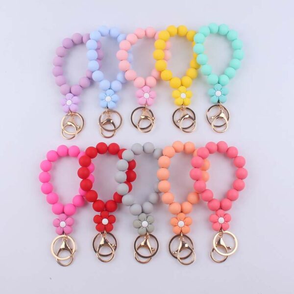 oly-b37b3dd3cad1fac7a13da96930205427 Wholesale Pink Silicone Cartoon Flower Beaded Wristband Keychain Boutique Jewelry Accessory