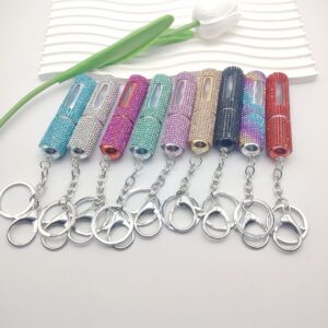 oly-b51e72b5589dd70bd448e07b9941141e Wholesale Fashion 5ml Refillable Perfume Spray Bottle Keychain Rhinestone Metal White Gift