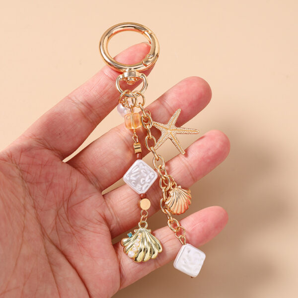 oly-b53cd7242c4e1995b814e4af5c80d151 Wholesale Sea Star Pearl Keychain Zinc Alloy Bag Charm Decorative Car Key Accessory