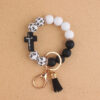 oly-b67e88488821e746b9cc5999b99e4fa6 Wholesale Silicone Cross Print Bead Bracelet Keychain with PU Tassel Fashion Accessory for Resale