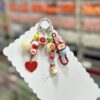 oly-b91c924bc5a84c68da88bab45347b24e Wholesale Cute Cartoon Keychain Phone Charm Bag Accessory for Boutique Resale OLY Exclusive