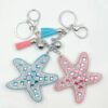 Wholesale Starfish Purple Glass Rhinestone Bag Charm Keychain with Tassel
