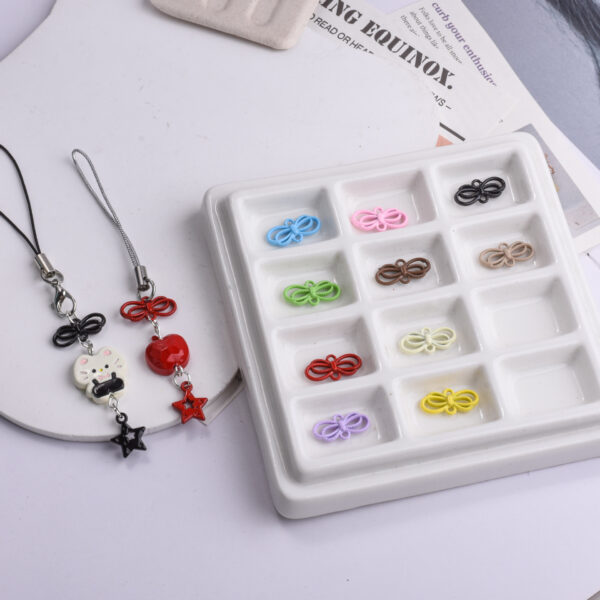 oly-bdd0e3b9bc0317e62fe3be10434d7002 Wholesale Alloy Cat Chinese Knot Pendant Phone Strap Charm Gift for Resale